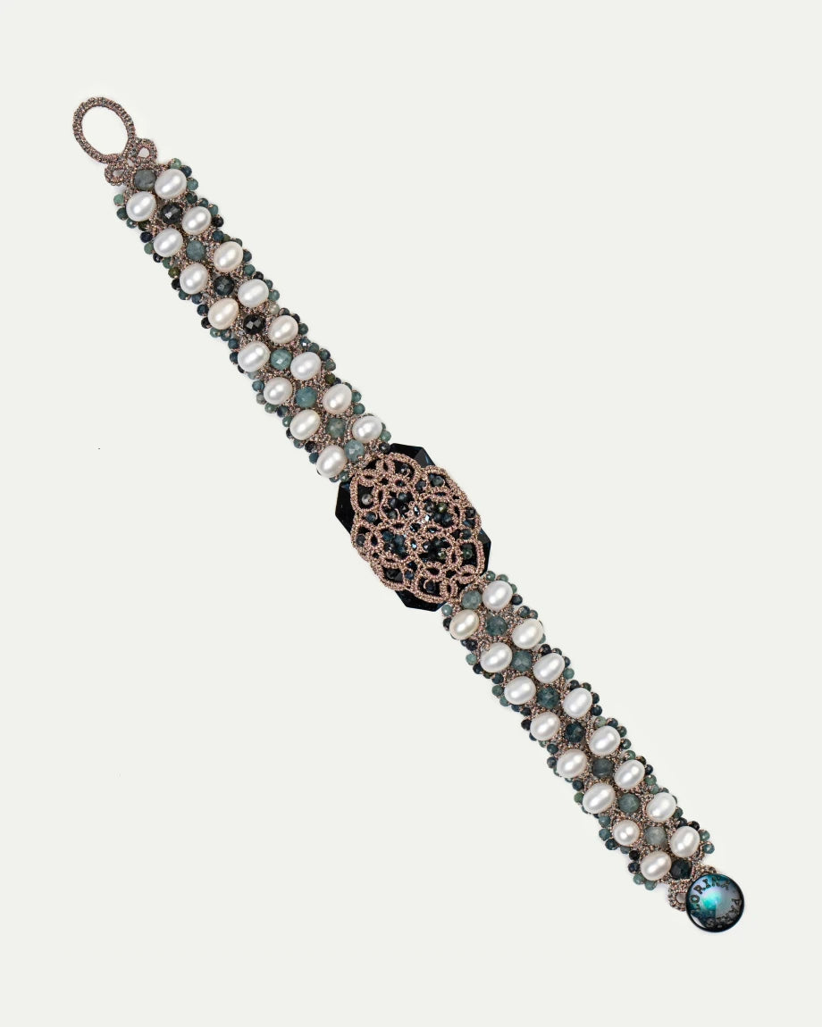 Blue silk bracelet with freshwater pearls and crystal accents featuring intricate design details.