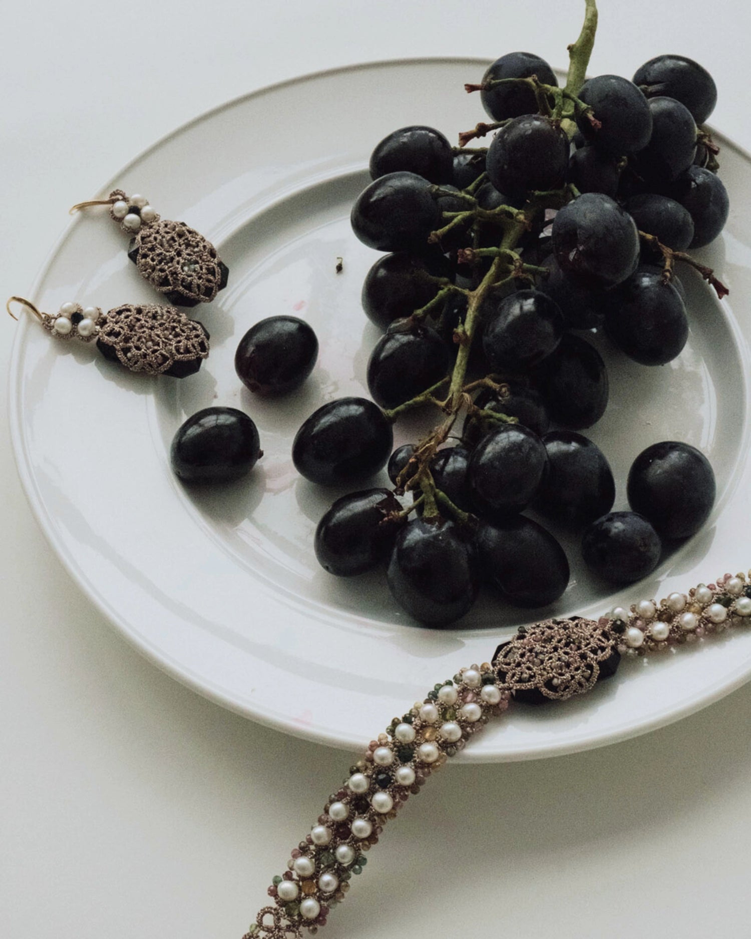 BARI EARRINGS in Silk, Gold, Silver color White close-up view with premium look and attention to detail