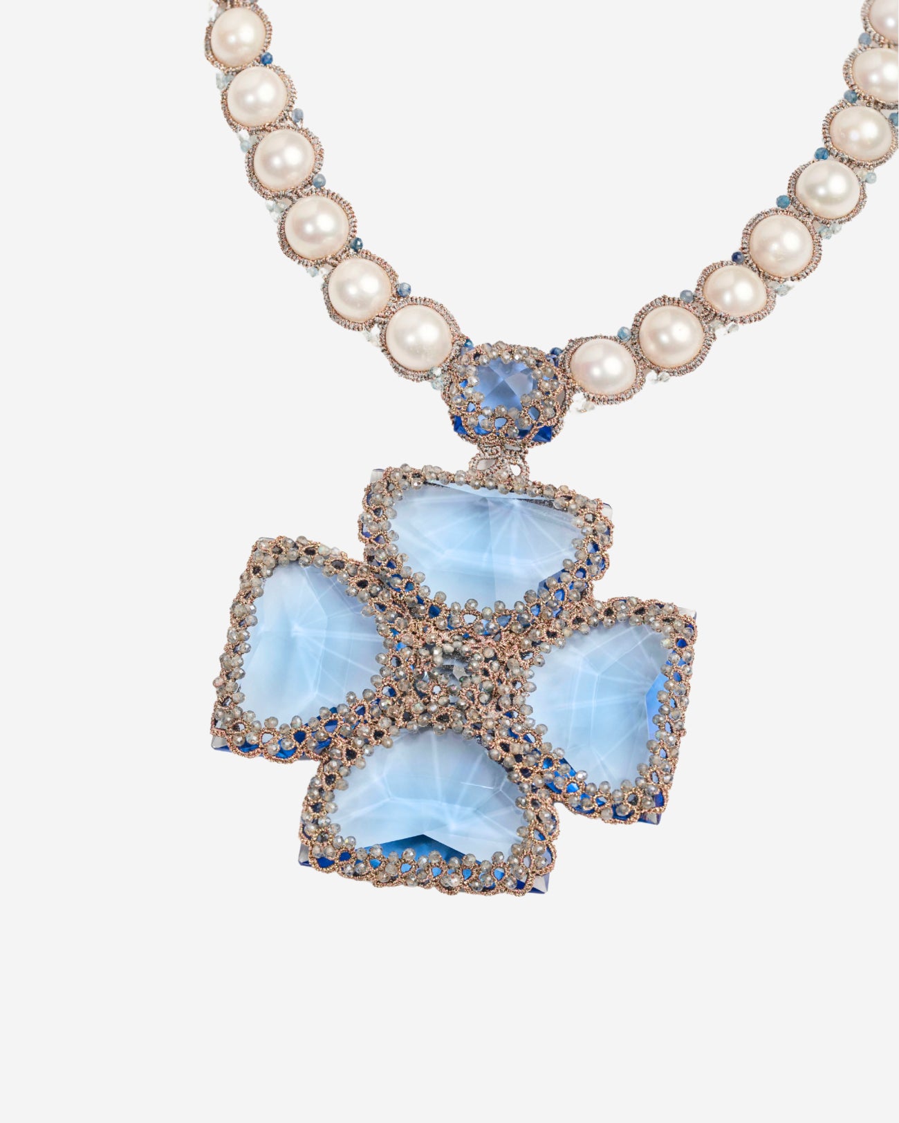 Blue silk and crystal necklace with pearl detail, featuring freshwater pearls and intricate texture.