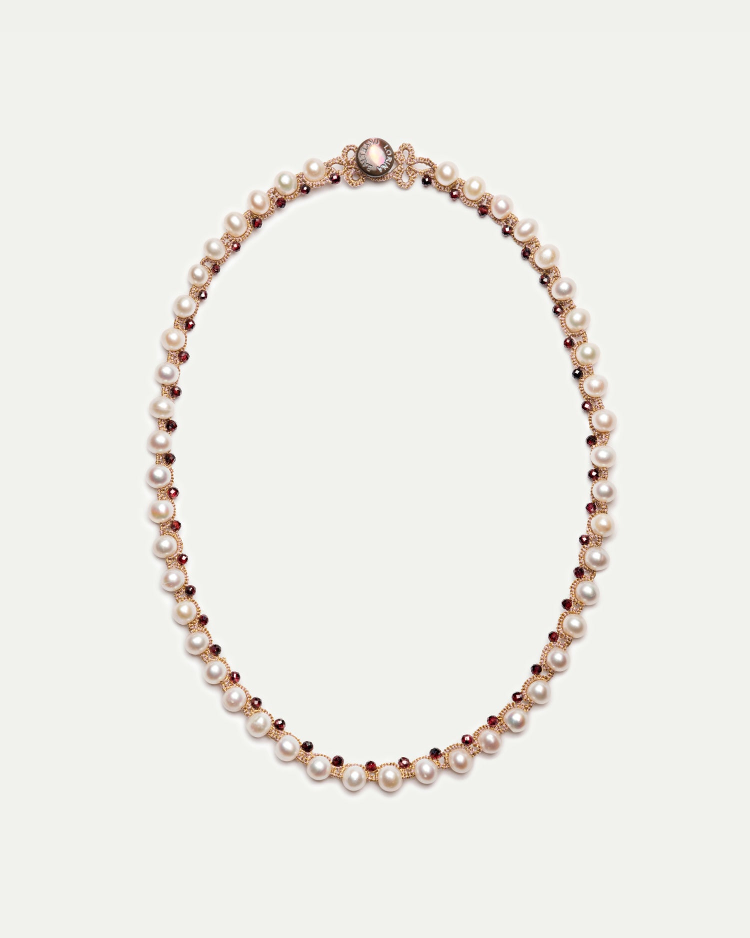 Red and white Dallas necklace with pearls and gemstones on elegant chain, side view.