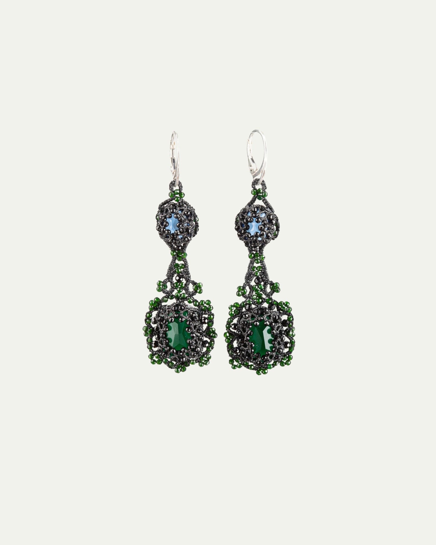 Black Eloise earrings with green and blue stones, intricate bead detailing, silver hooks, side view angle.
