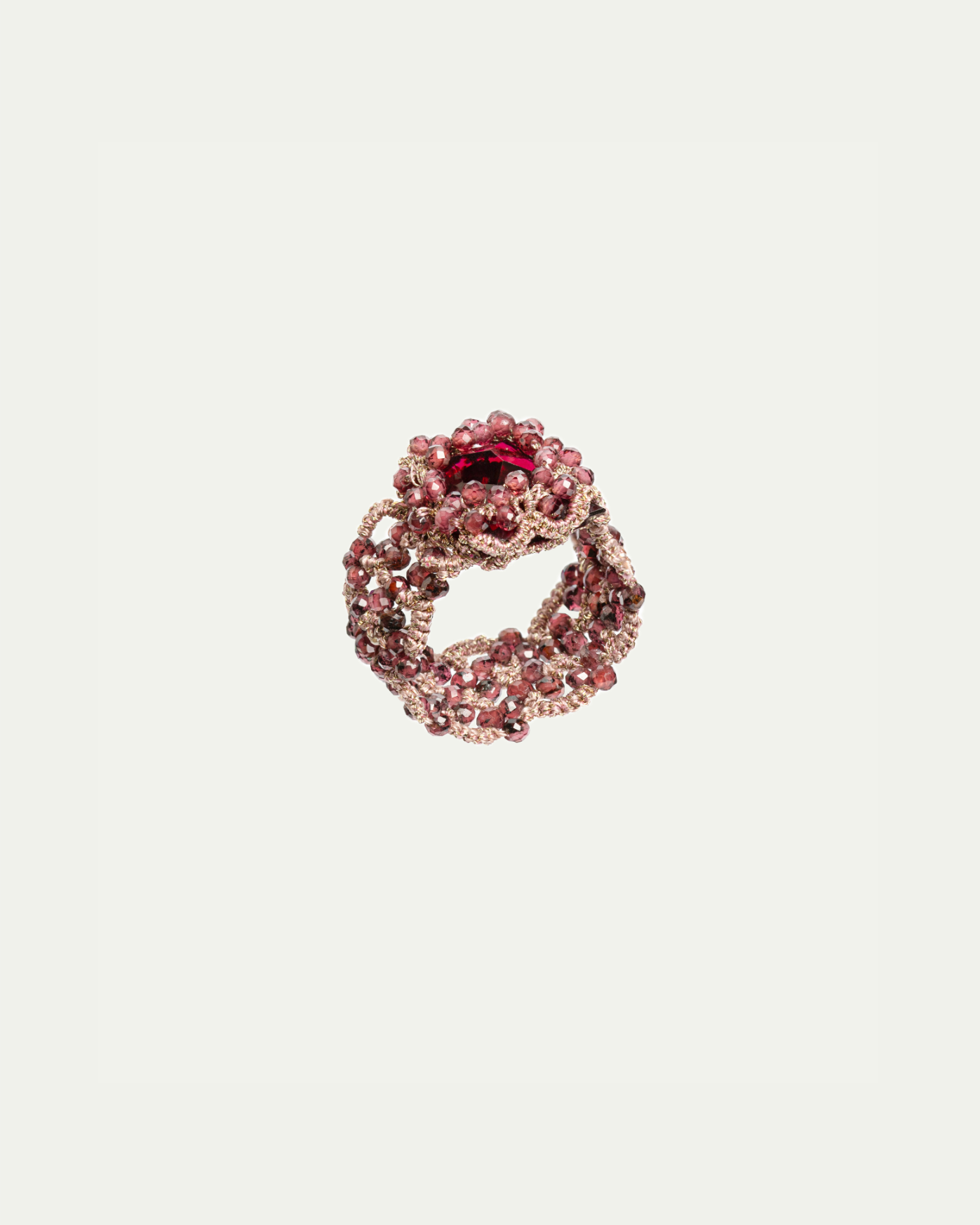Crimson silk ring with intricate bead detailing and textured fabric design