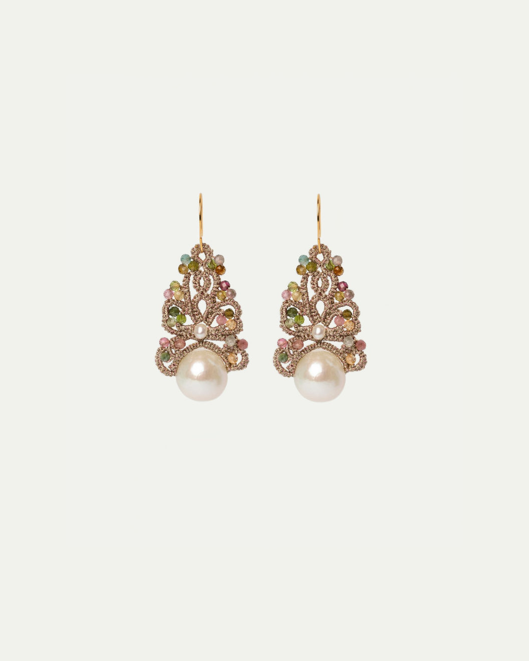 Intricate multicolor earrings with gemstones, pearls, and gold accents in a filigree design.
