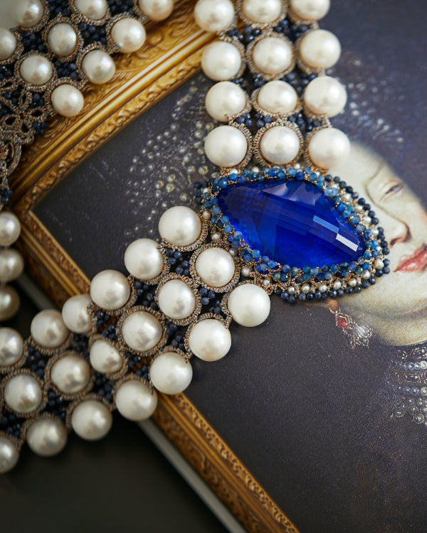 Blue silk and kyanite necklace with freshwater pearls, detailed texture and pearly design.