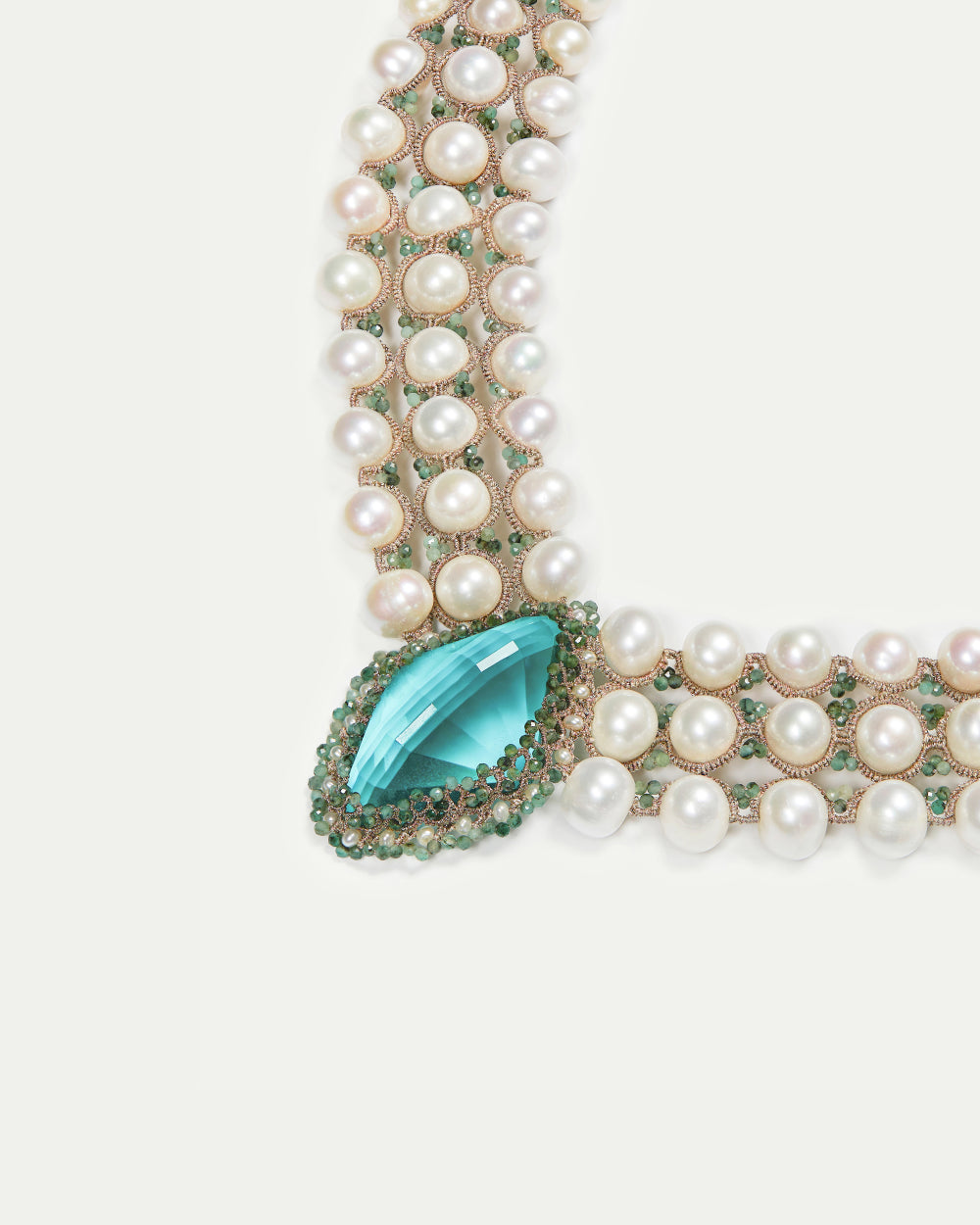 Green silk necklace with freshwater pearls and sapphire detailing.