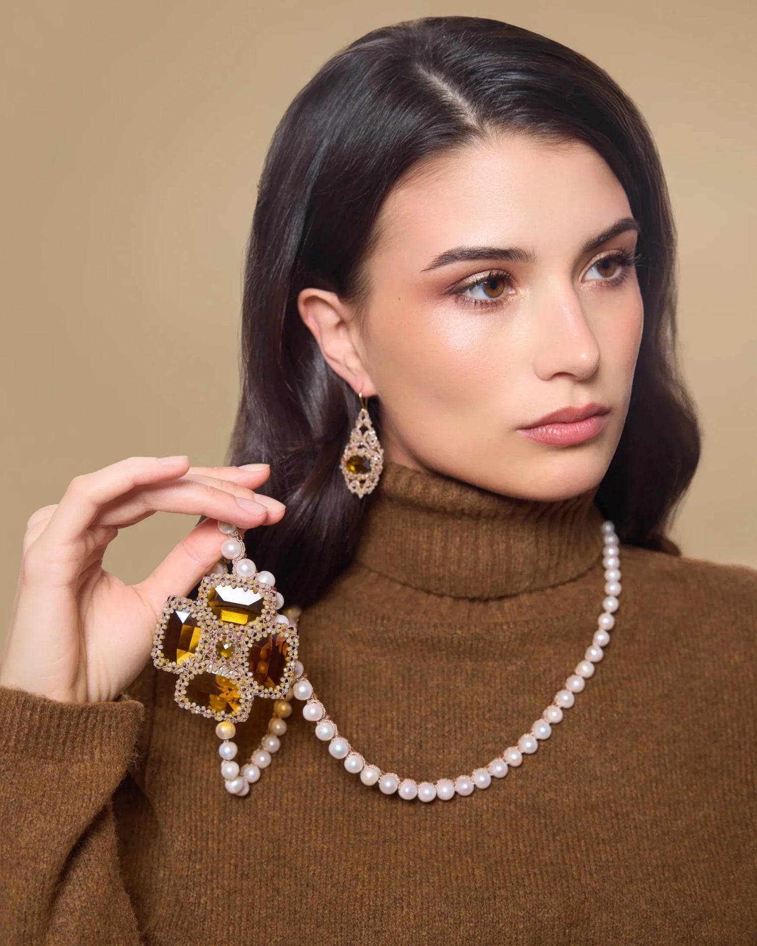 Gold KIARA earrings with silk, crystal, garnet, intricate textures, and detailed craftsmanship.