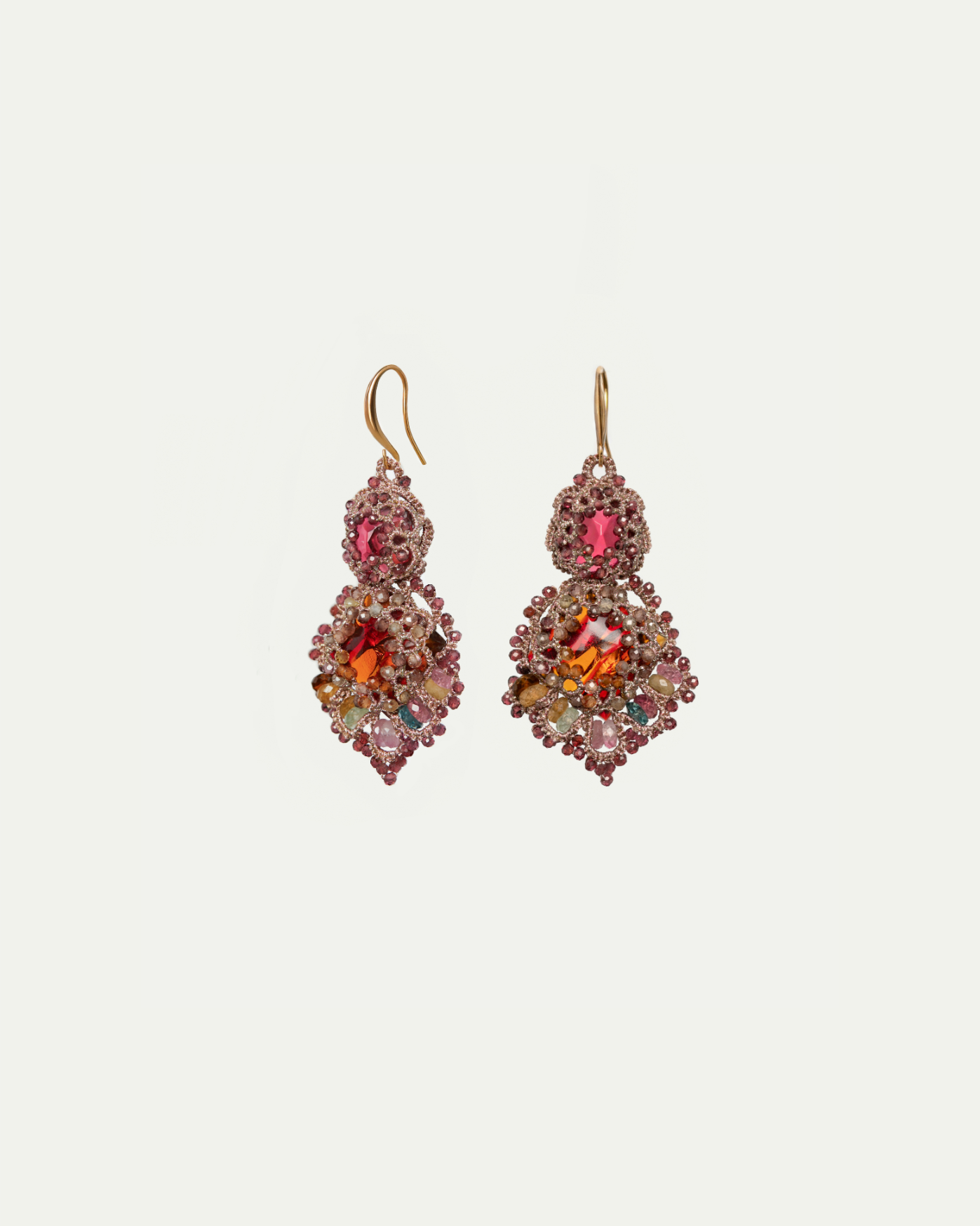 Red silk earrings adorned with multicolored gemstones and intricate detailing.