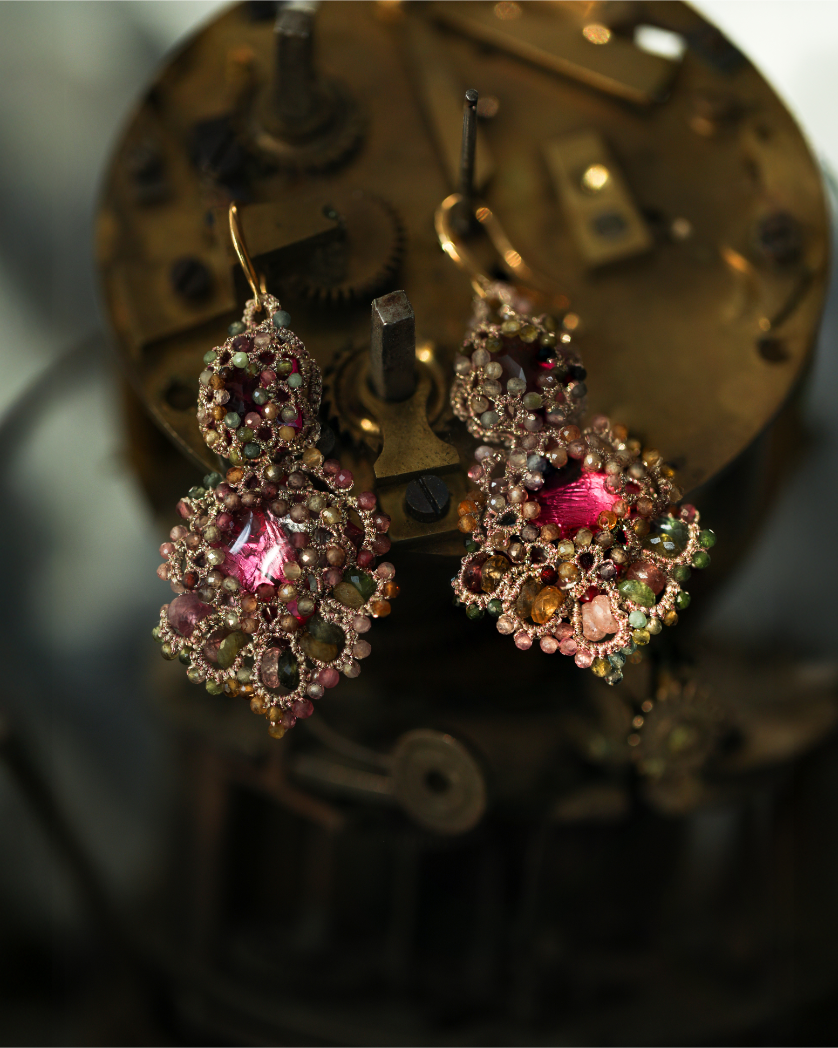 Rose silk Kimberly earrings with intricate gemstone detailing and gold hooks, highlighting texture and material.