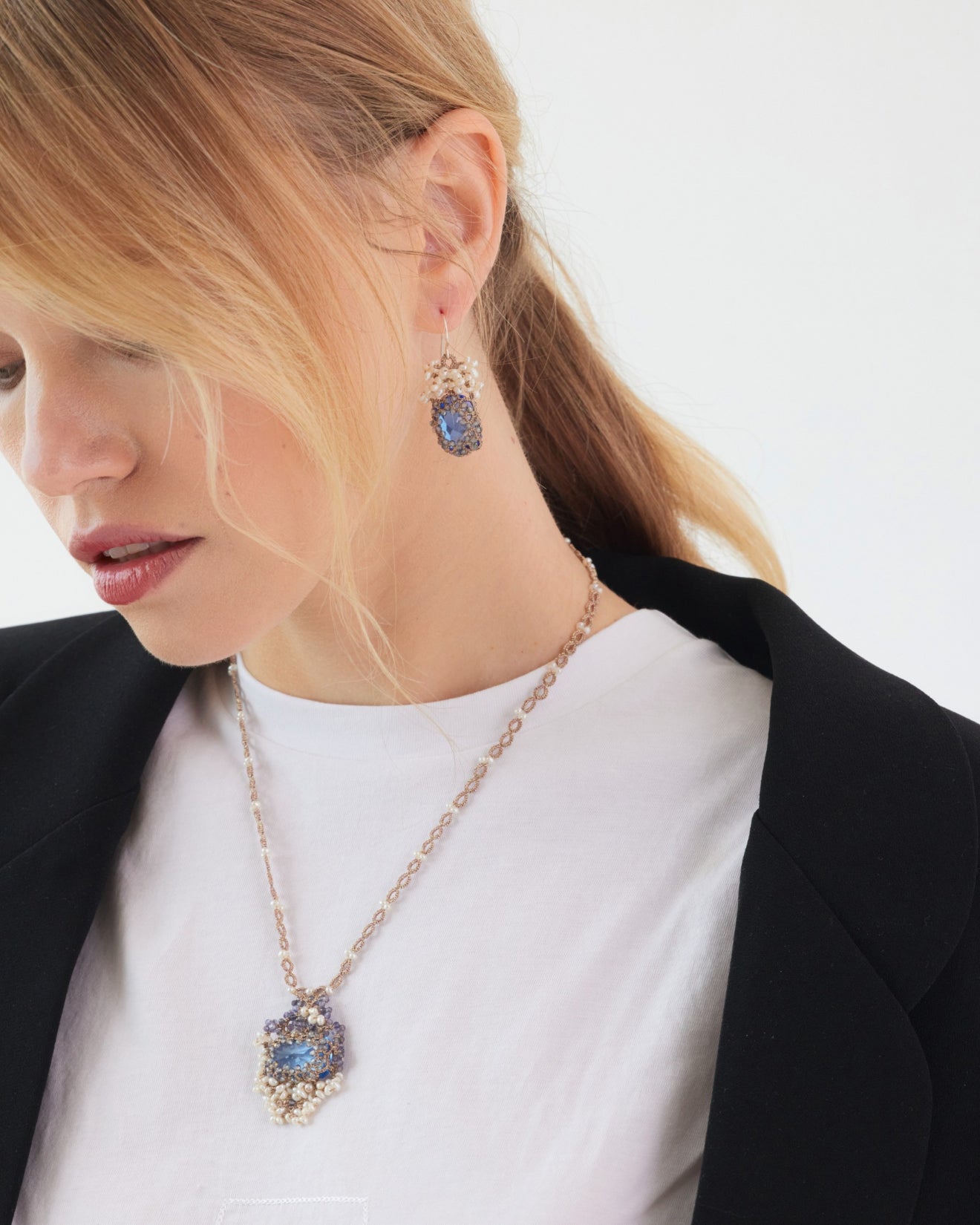 Blue crystal and freshwater pearls on silk chain necklace, detailed design.