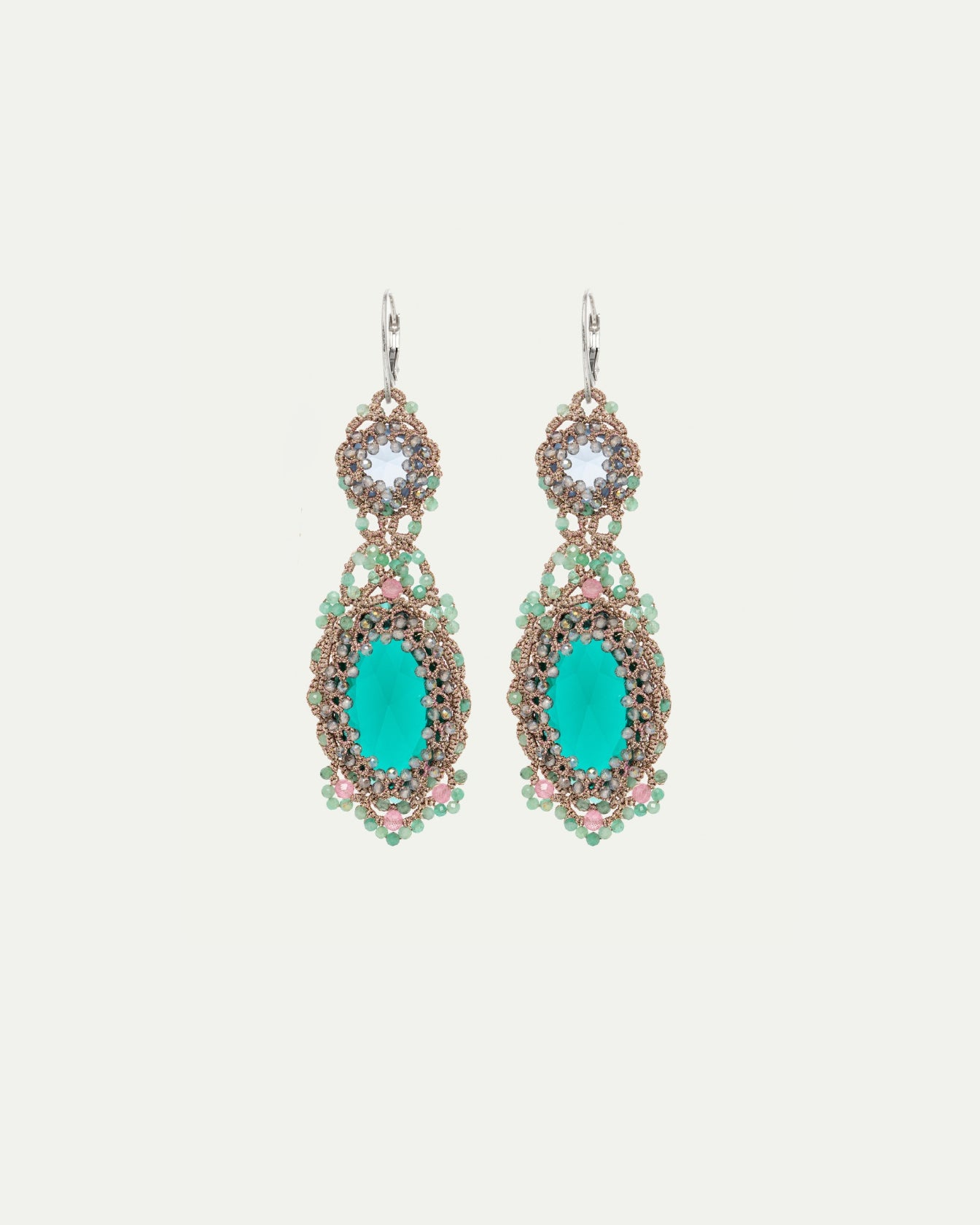 Green Serena Lux earrings with intricate crystal and bead detailing, silver hooks, and oval centerpiece.