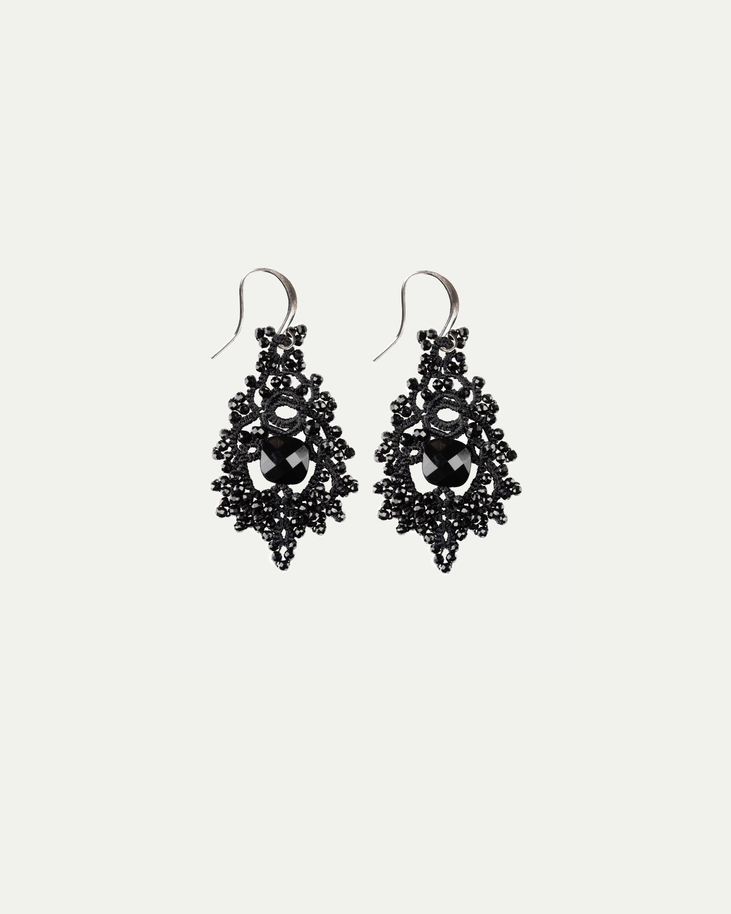 TIRAS EARRINGS in Silk, Silver, Glass color Black front view with elegant and refined design