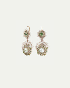 Gold and silver earrings with freshwater pearls, green crystals, and intricate detailing.