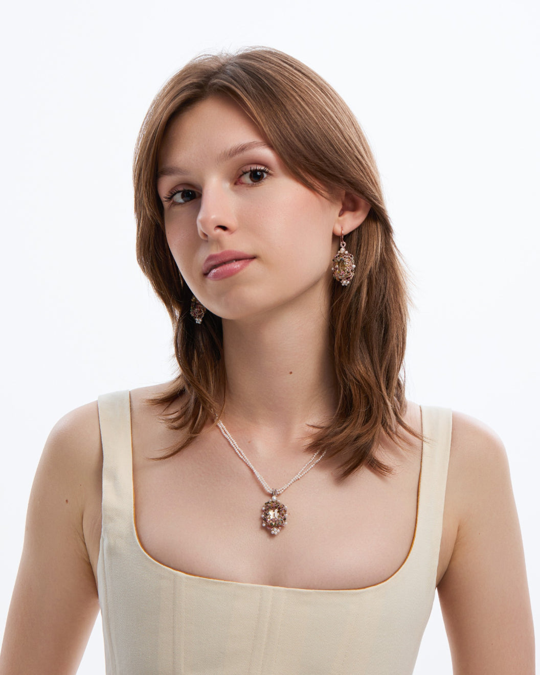 AUDREY EARRINGS in Silk, Gold, Silver color Gold close-up view with premium look and attention to detail