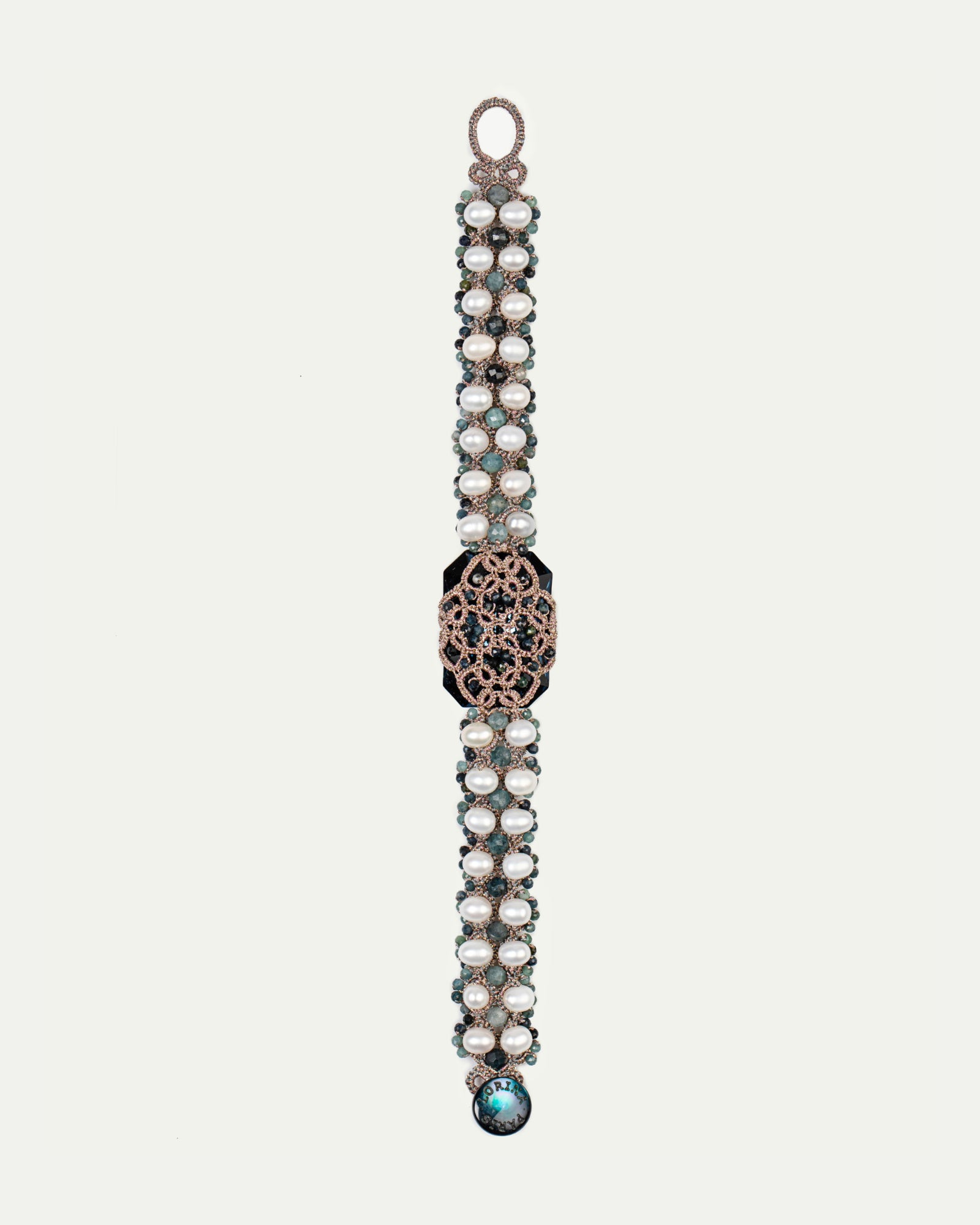 BARI BRACELET with pearls, blue tourmaline gemstones, crystal, silk threads, and mother of pearl button.
