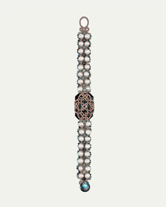 BARI BRACELET with pearls, blue tourmaline gemstones, crystal, silk threads, and mother of pearl button.