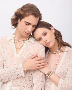 Silk and multicolor tourmaline choker with layered freshwater pearls, detailed clasp, and intricate pearl detailing.