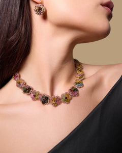 CALLA NECKLACE in Silk, Pearl, Garnet color Gold side view with decorative details and quality finishes
