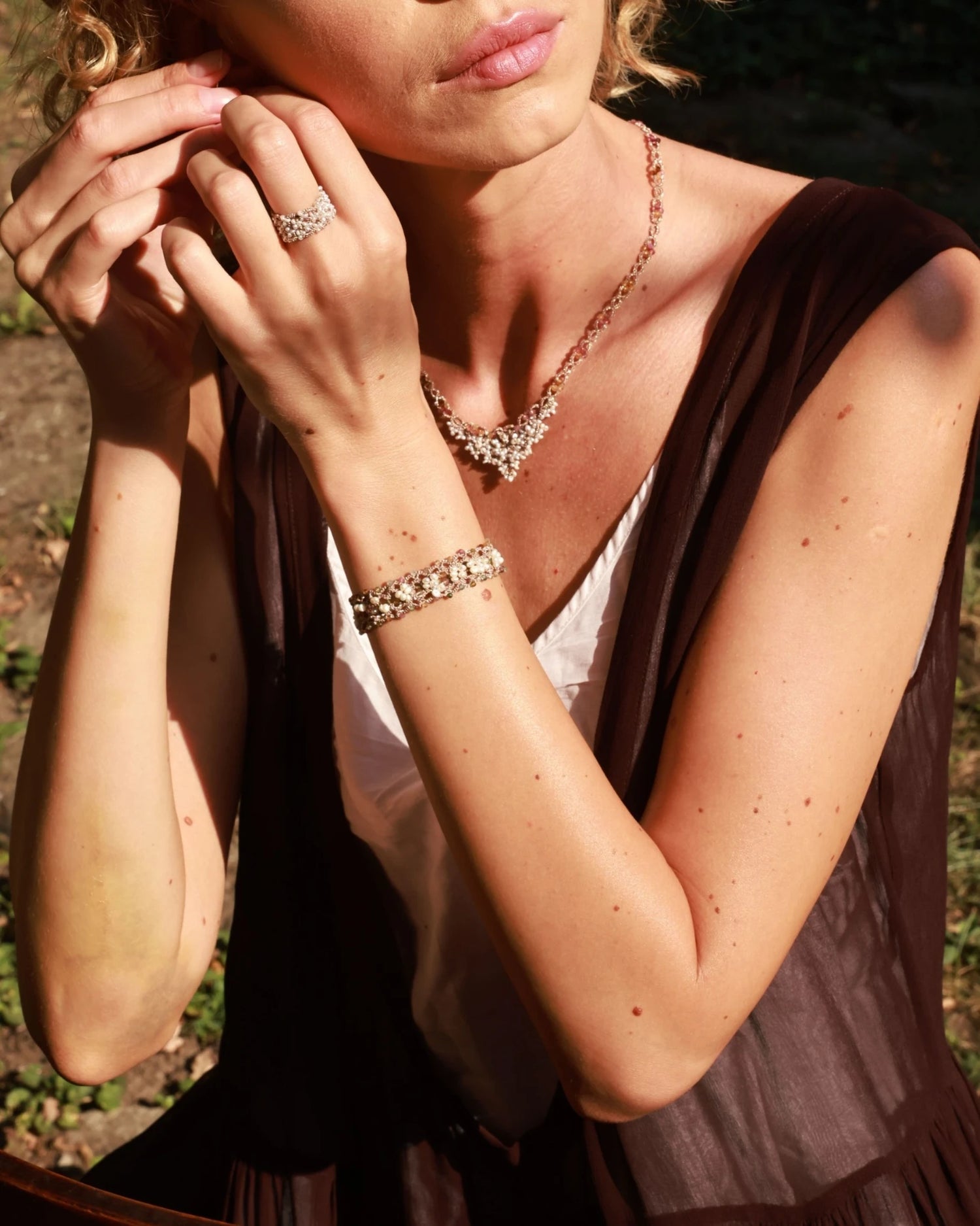 Silk band with clustered freshwater pearls and clear beads, elegant shimmer, natural cream tones.