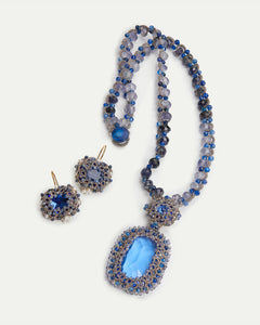 Blue Claudia Pendant with silk, pearl, kyanite beads, and glass details. Rich texture and intricate design.