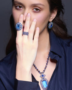 Blue Kyanite pendant with silk texture, pearl accents, detailed view with matching earrings and rings.