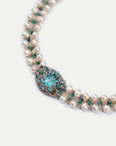 Blue CLEO choker in silk with freshwater pearls and crystals, intricate detail showcasing texture.