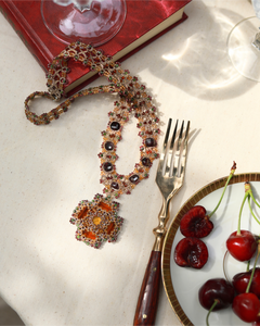 DAHLIA NECKLACE in Silk, Pearl, Crystals color Red detail view with classic and elegant design