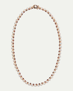 Dallas necklace with freshwater pearls, garnet beads, red silk thread, close-up detail showing texture and clasp design.
