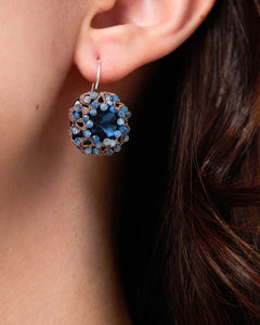 Blue Dani earrings with faceted stones, silver hook, and intricate detailing, side view showcasing craftsmanship.