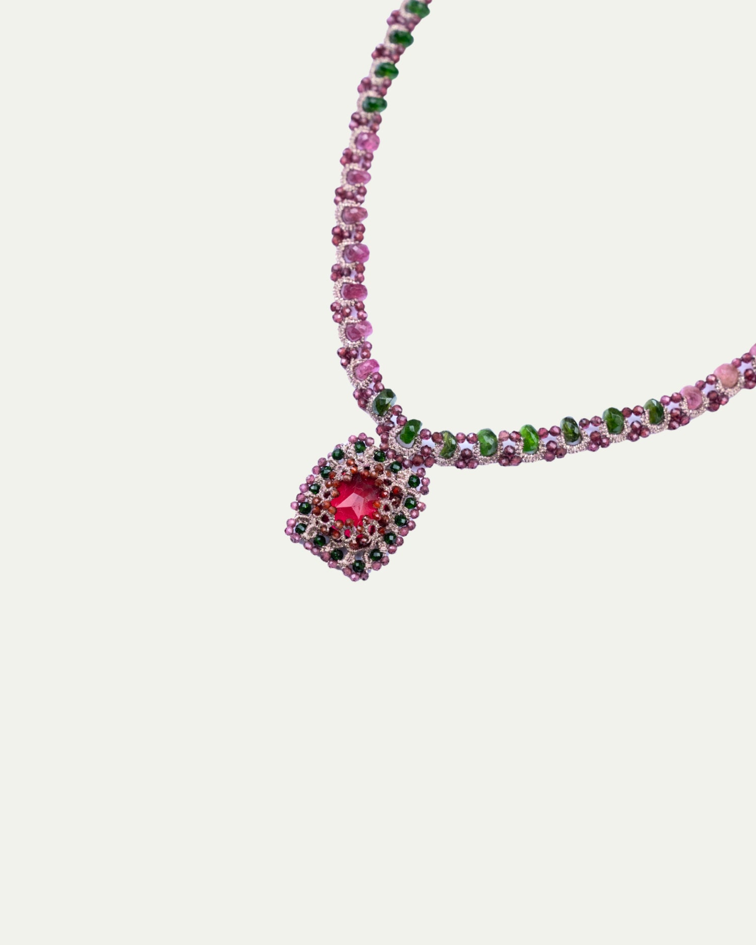 Red Delphine Necklace detail with silk, garnet, pearl, and crystal, showing intricate beadwork and vibrant colors.
