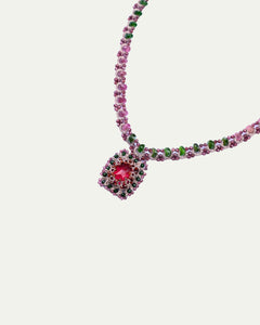 Red Delphine Necklace detail with silk, garnet, pearl, and crystal, showing intricate beadwork and vibrant colors.