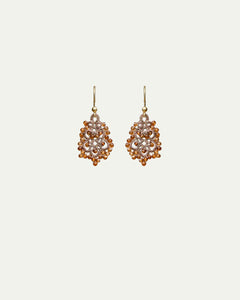 Dora earrings with orange garnet gemstones, silk, gold-plated silver hooks, intricate design.
