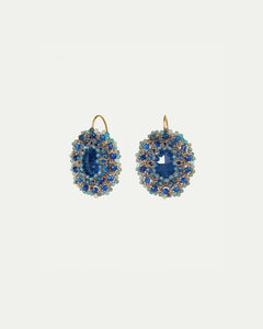 Gold hoop earrings with blue kyanite and crystal beads, featuring silk and silver accents for intricate detailing.