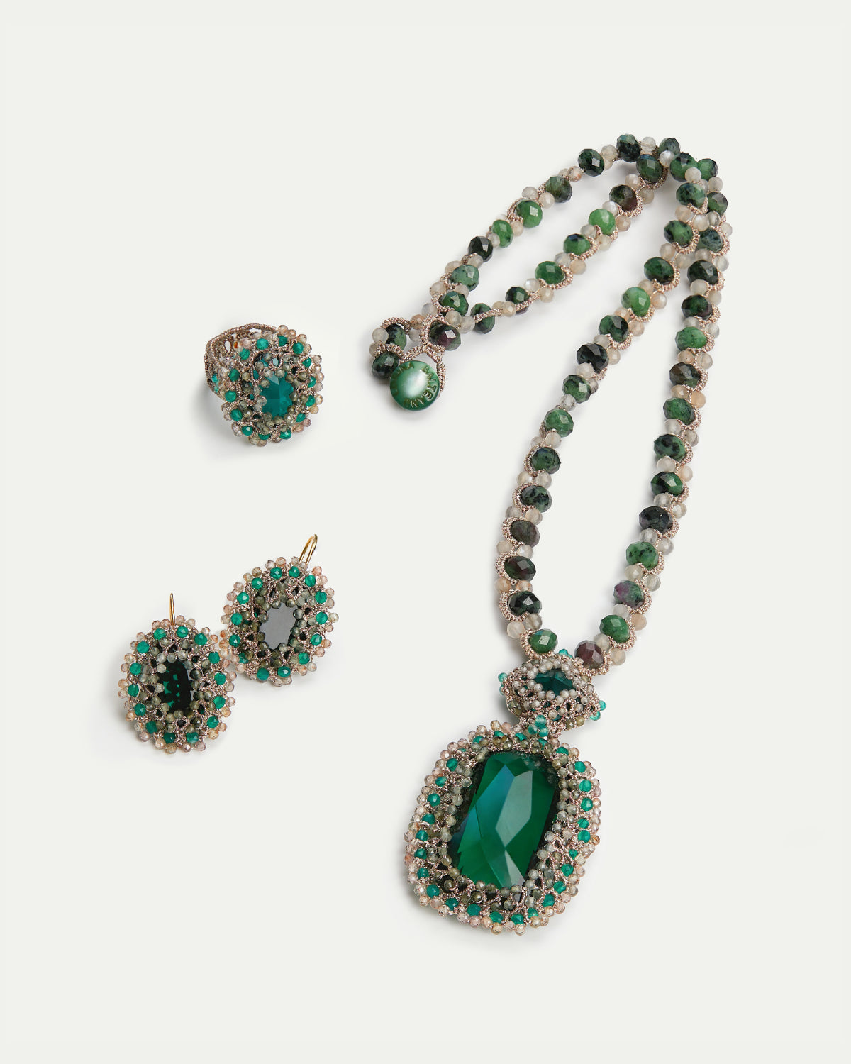 Green ECATERINA RING with silk, crystal, emeralds, and tourmaline details, ring sizes 54, 56, 57.