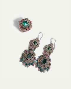 Green silk earrings with intricate multicolor bead details, featuring a prominent central gem.