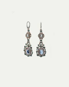 Blue Eloise earrings featuring silk, gold, silver, crystal, and topaz with intricate texture detailing.