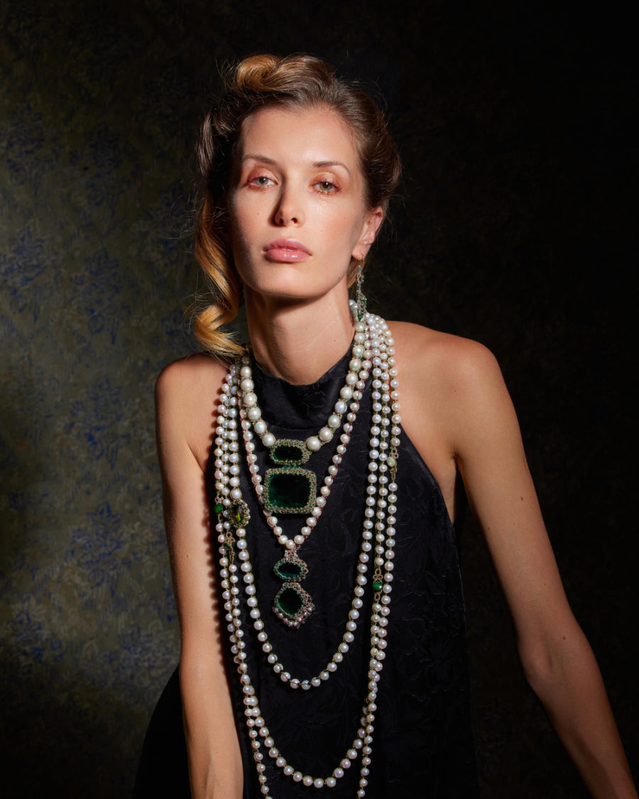 Necklace with blue gemstones on a light gray background