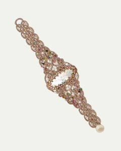 White silk bracelet with freshwater pearls, tourmaline beads, intricate design detail, and pearl clasp.
