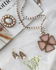 GEORGIA PENDANT with freshwater pearls, tourmaline, rose silk, mother of pearl button, glass, and metallized threads.