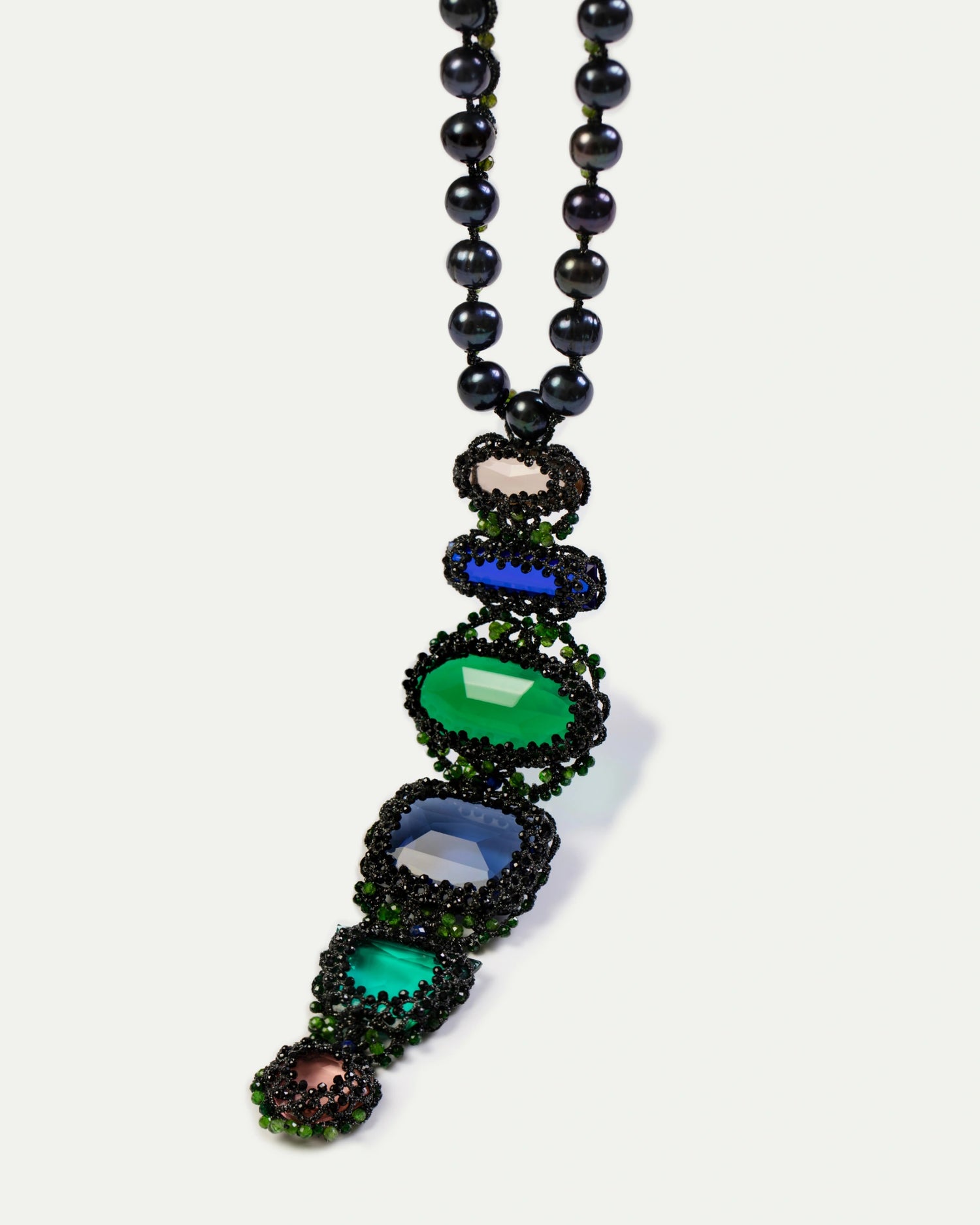 Black freshwater pearl pendant with colored glass stones and intricate detailing.