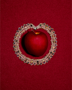 GRACE NECKLACE with multicolor gemstones, silk threads, mother of pearl button encircles a red apple on red backdrop