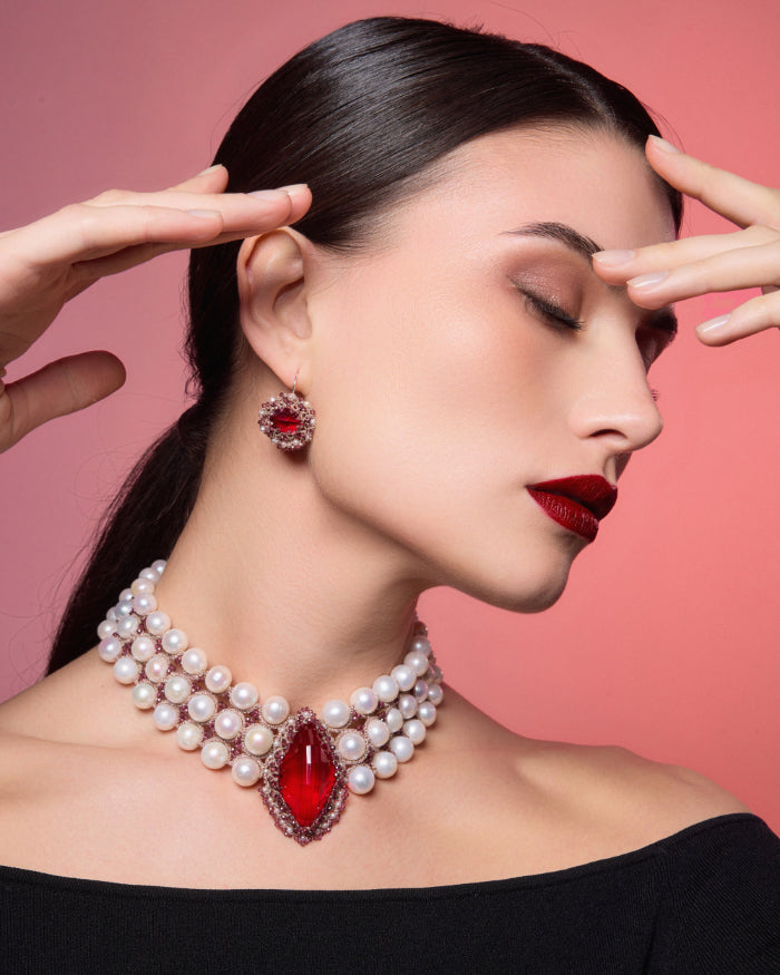 Red Hepburn earrings with gold accents, intricate silk details, freshwater pearls, and silver components.