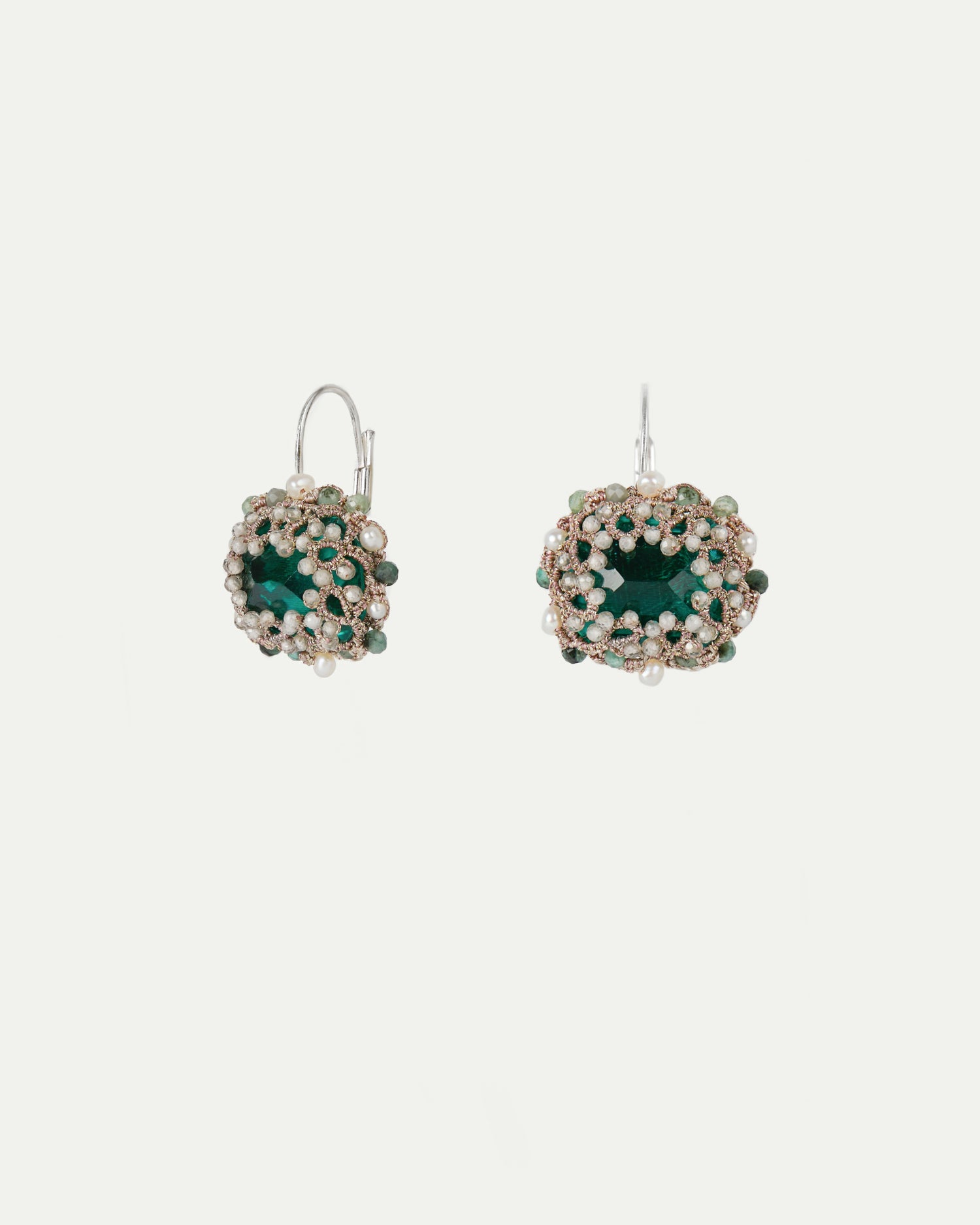 Green silk, crystal, and silver earrings adorned with freshwater pearls.