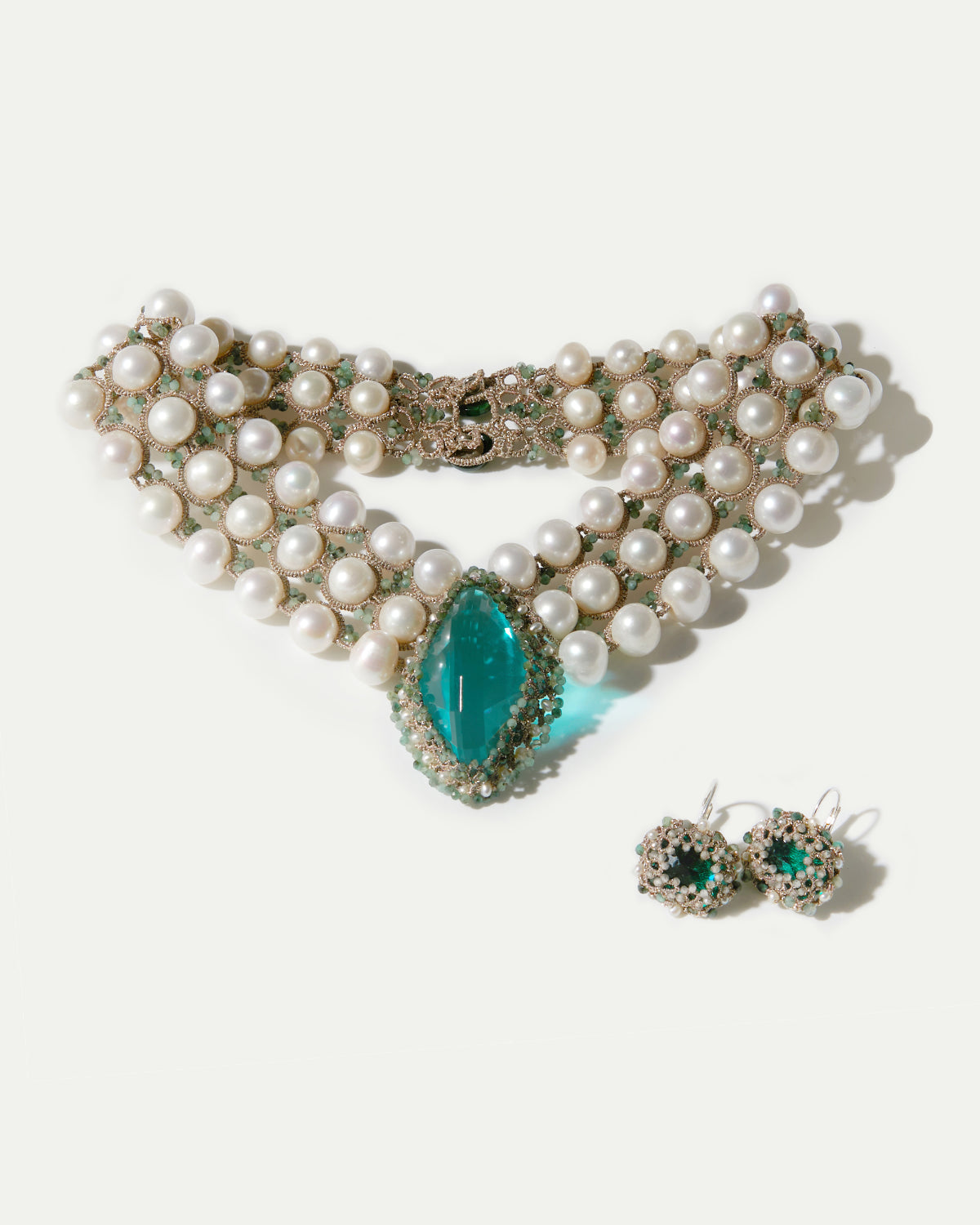 Green silk earrings with silver and freshwater pearls, detailed with crystals and crystal textures.