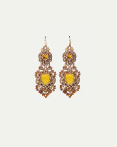 Gold INESSE earrings with intricate lace-like design, featuring yellow gemstones and bead accents in a side view.
