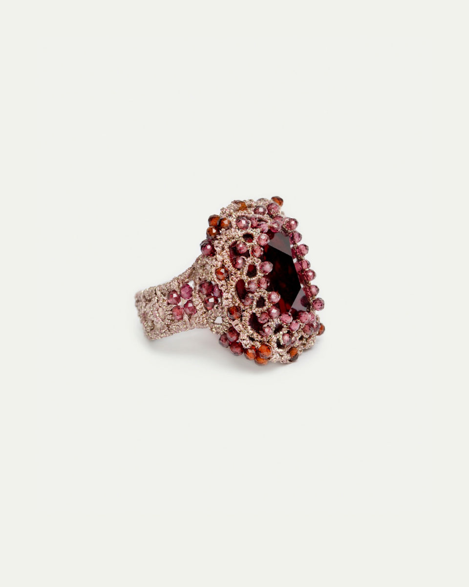 Red LOLA RING with silk texture, garnet centerpiece, and crystal detailing in sizes 51, 52, 54.