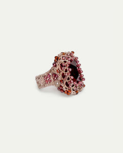Red LOLA RING with silk texture, garnet centerpiece, and crystal detailing in sizes 51, 52, 54.