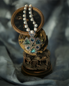 LYDIA NECKLACE in Silk, Pearl, Pearls color Blue side view with decorative details and quality finishes