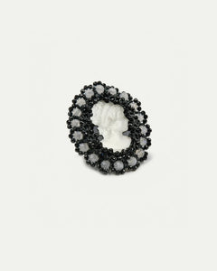 Black Margueritte brooch side view, intricate beadwork, cameo centerpiece, circular design, elegant detail