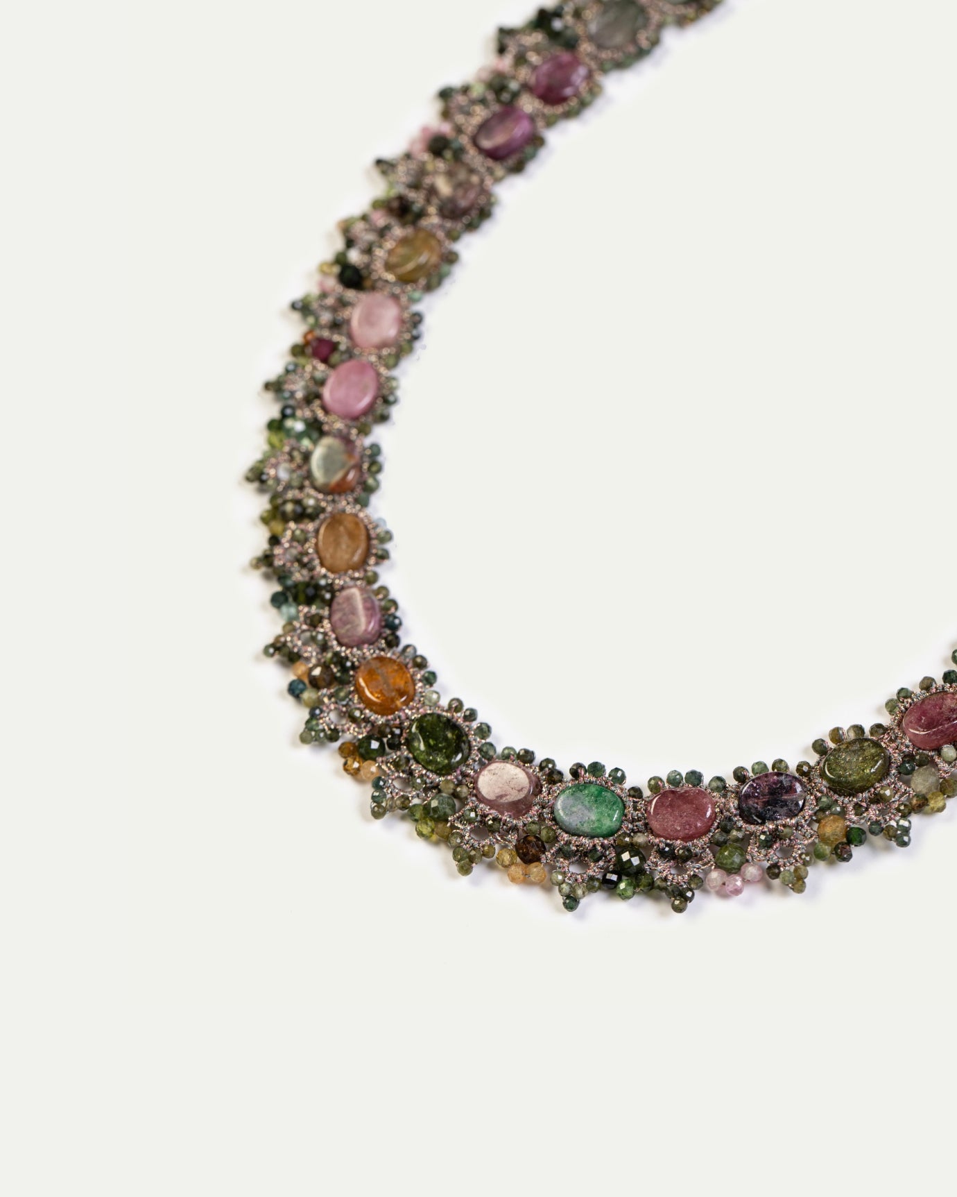 Silk necklace adorned with multicolor tourmaline gemstones and pearls, showcasing intricate detailing.