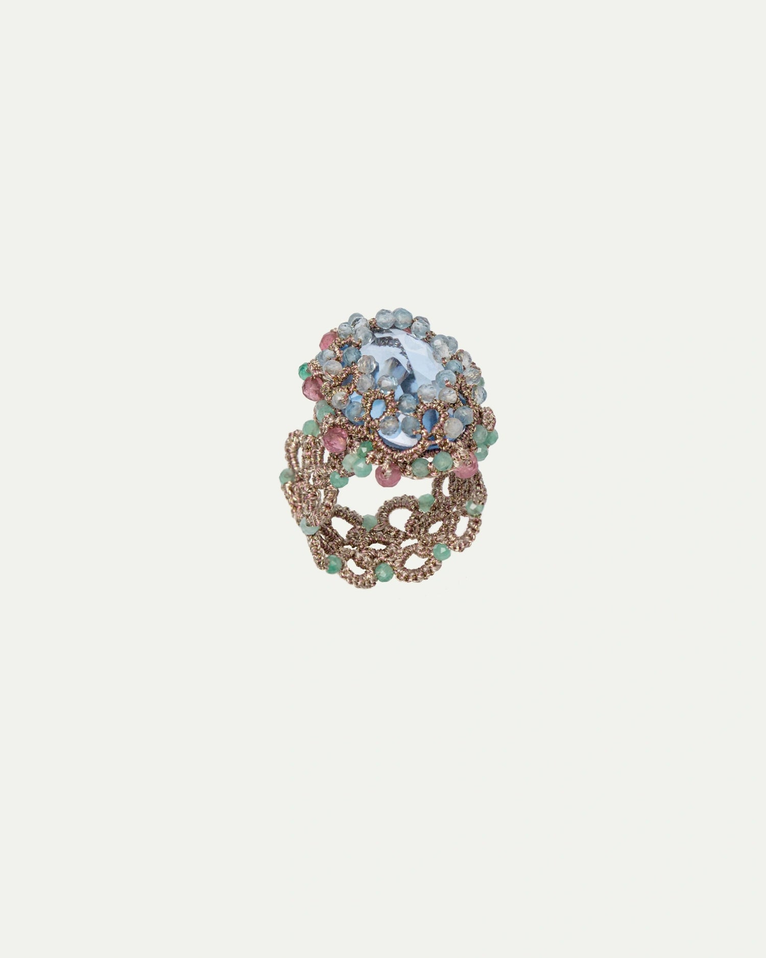 OLYMPIA RING with blue aquamarine, pink tourmaline, emerald gemstones, silk, and metallized threads.